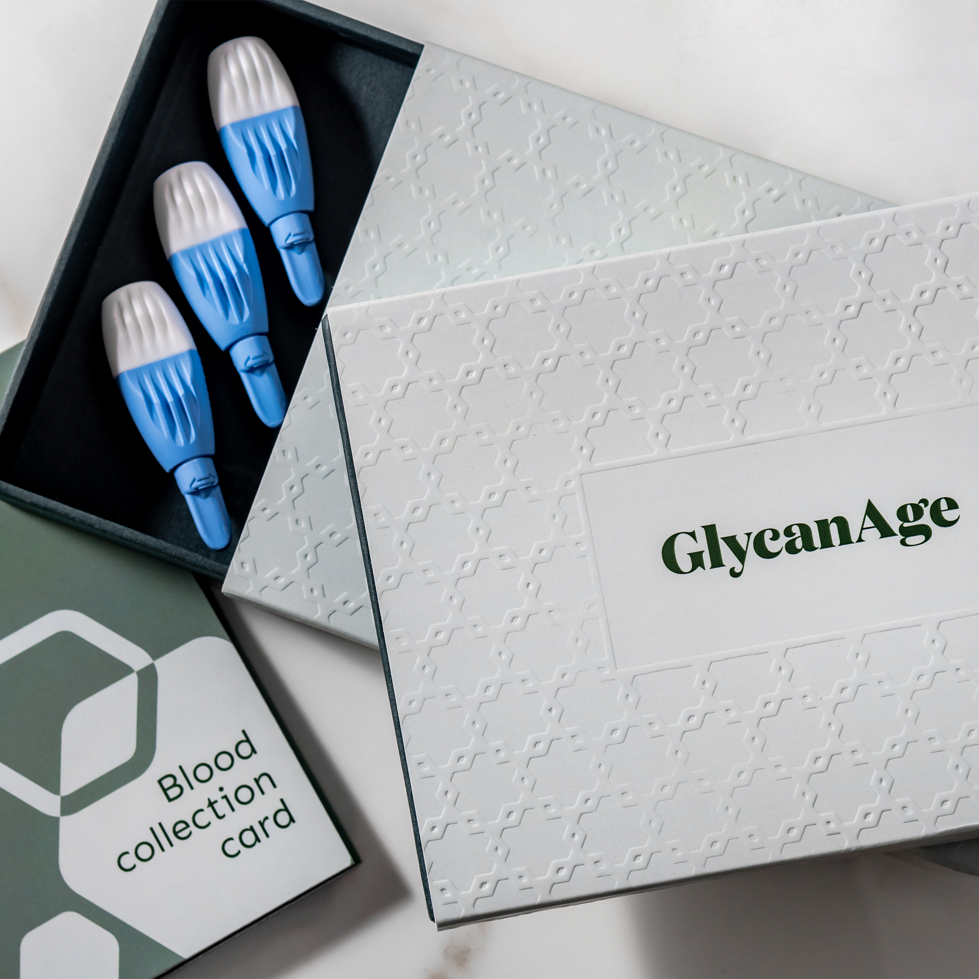 GlycanAge Comprehensive AGE Testing Kit with blood collection card and sampling devices for biological age test.