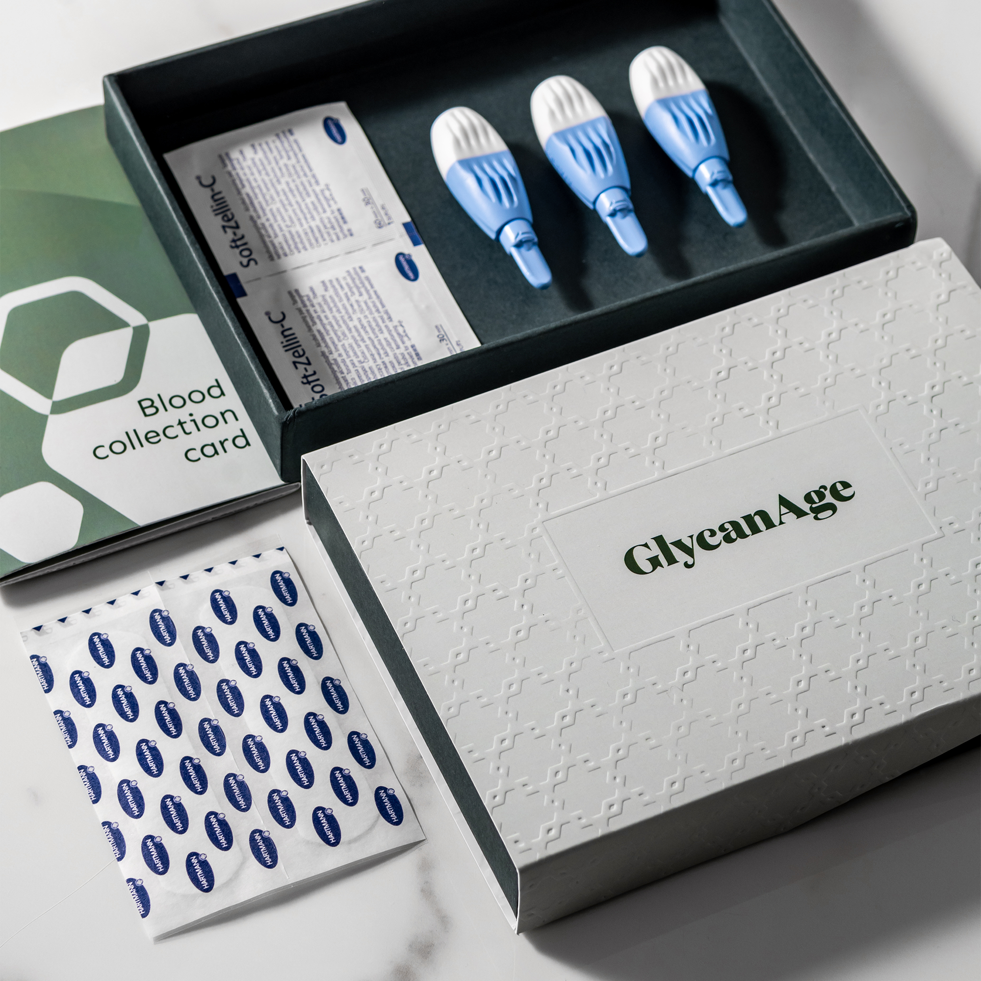 GlycanAge Comprehensive AGE Testing Kit with blood collection tools and packaging for measuring biological age